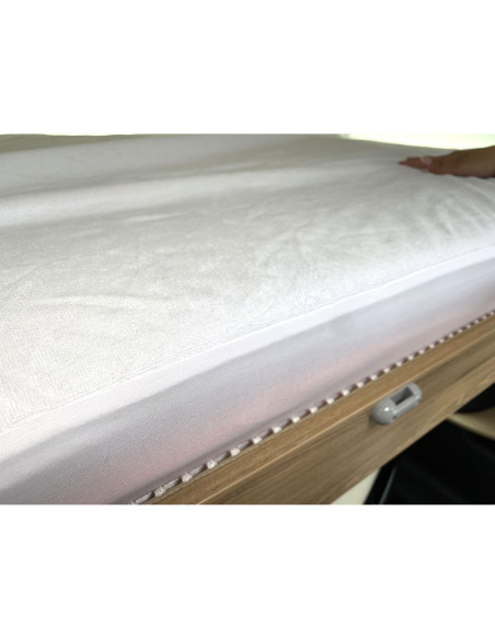 Protége-matelas imperméable 130 x 190 cm coupe gauche